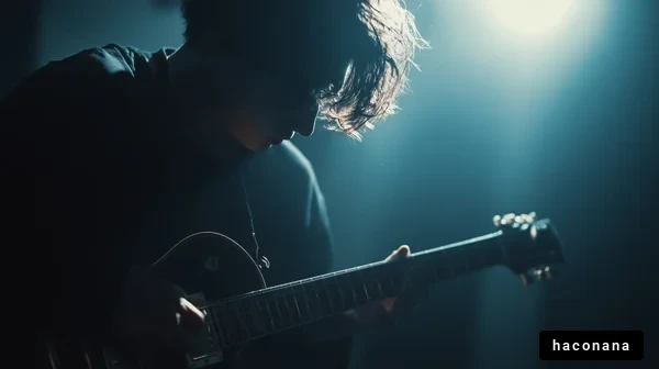 ギターを弾く若者の姿