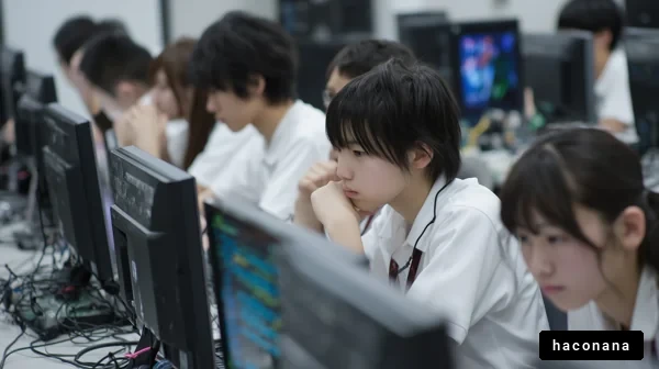 コンピュータ前の集中する生徒たち
