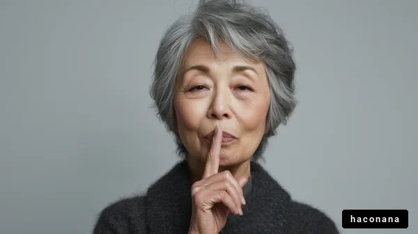 静かにする女性の表情