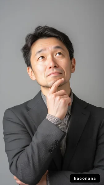 考え込むビジネスマンの画像