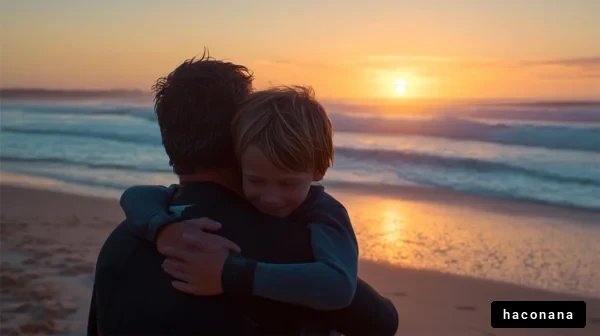 夕日を背に抱き合う親子