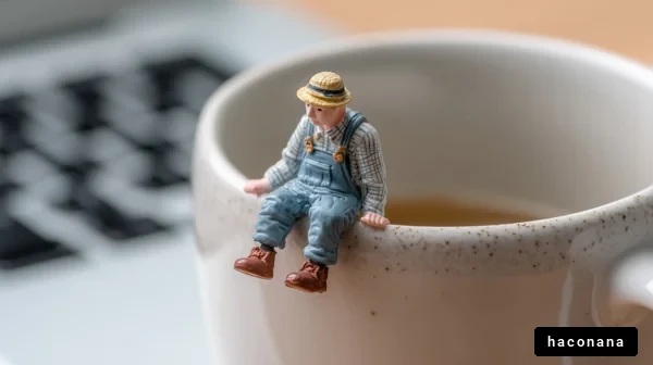 コーヒーカップに座る人形