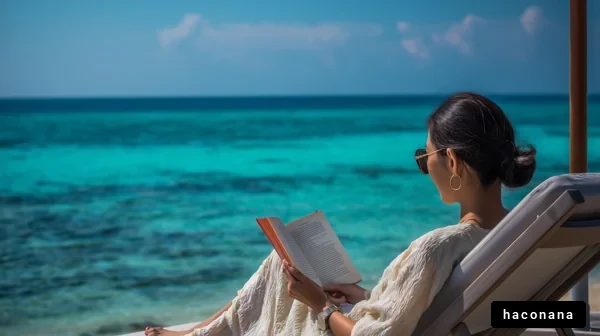 美しいビーチで読書する女性