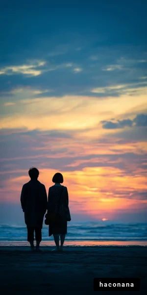 夕焼けの海辺に立つ二人