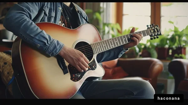 室内でギターを弾くシーン