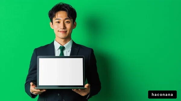 ビジネスマンがパソコンを持つ