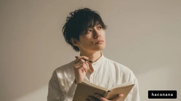 考える若者のポーズ