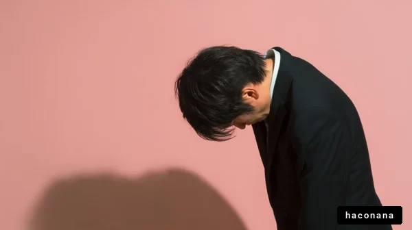謝罪の姿勢をとる男性