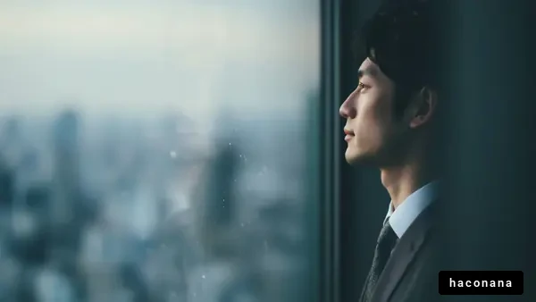 窓の外を見つめるビジネスマン